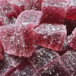 Macro Close Up of Pixel Pour Gummies in Black Cherry Flavor