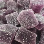 Macro Close Up of Pixel Pour Gummies in Galactic Grape Flavor